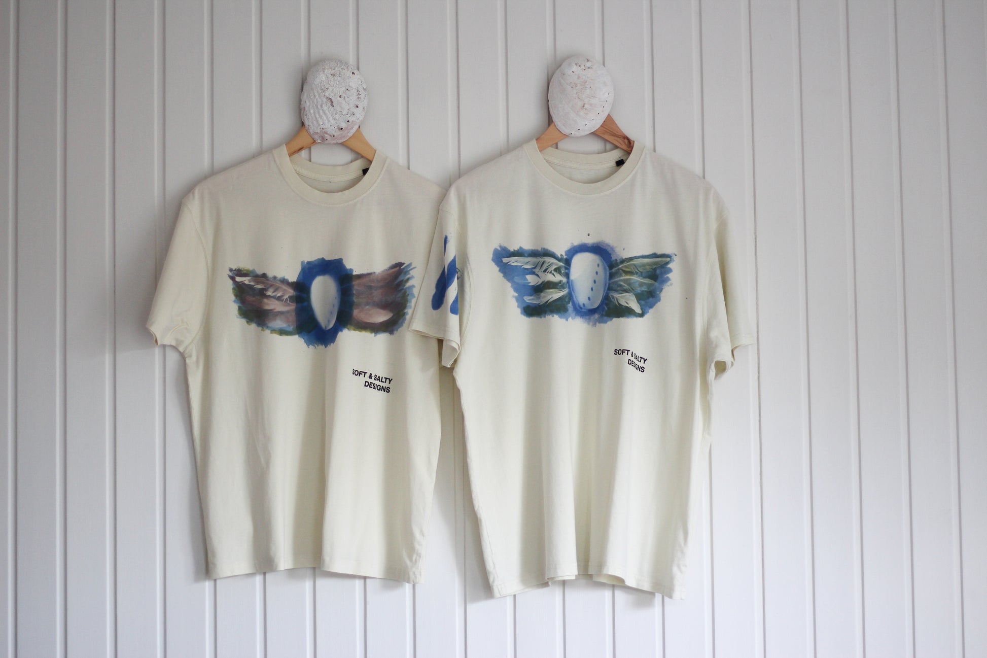 Two hand-printed abalone shell design t-shirts.