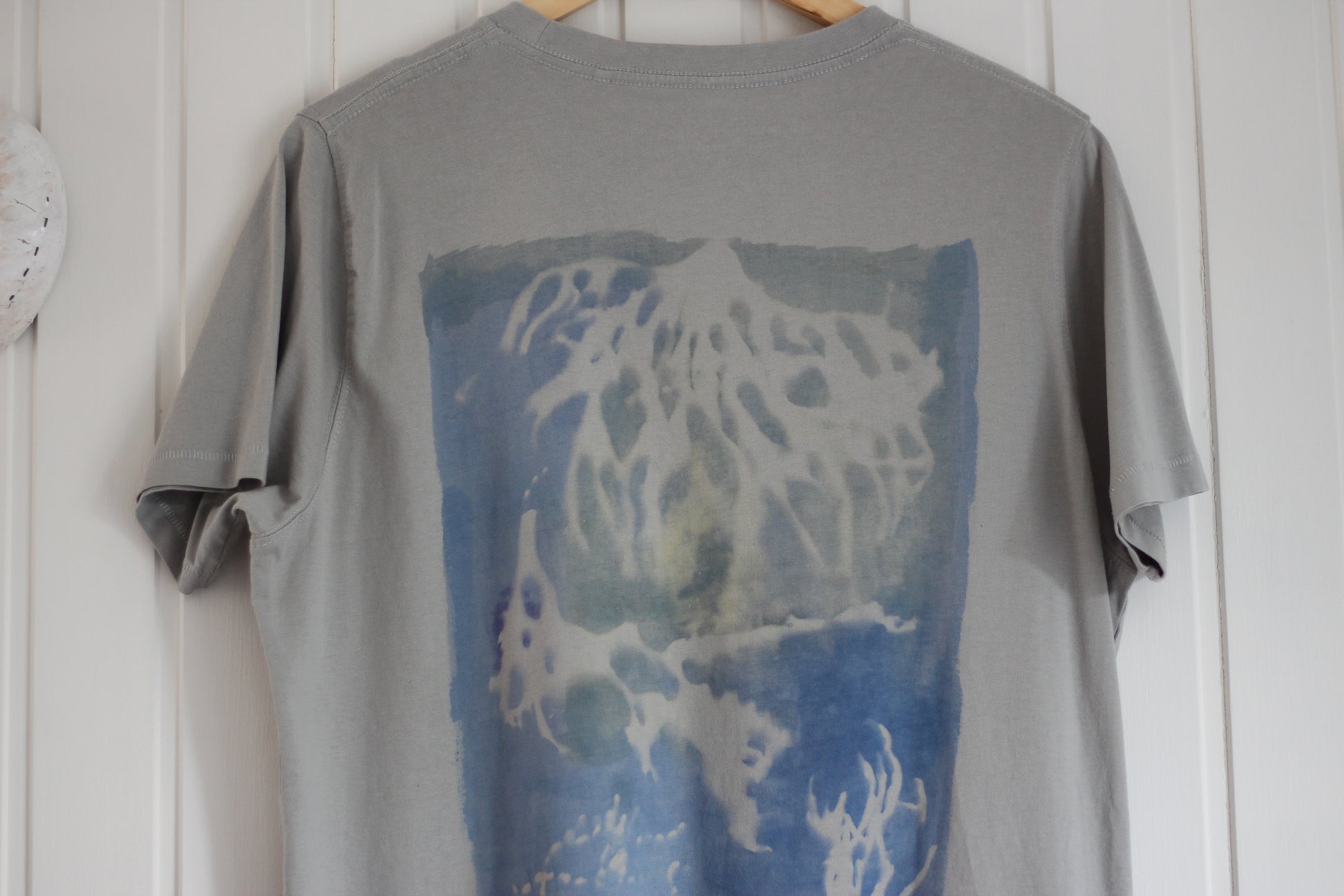 Gray graphic t-shirt with blue sea sponge hand painted design.