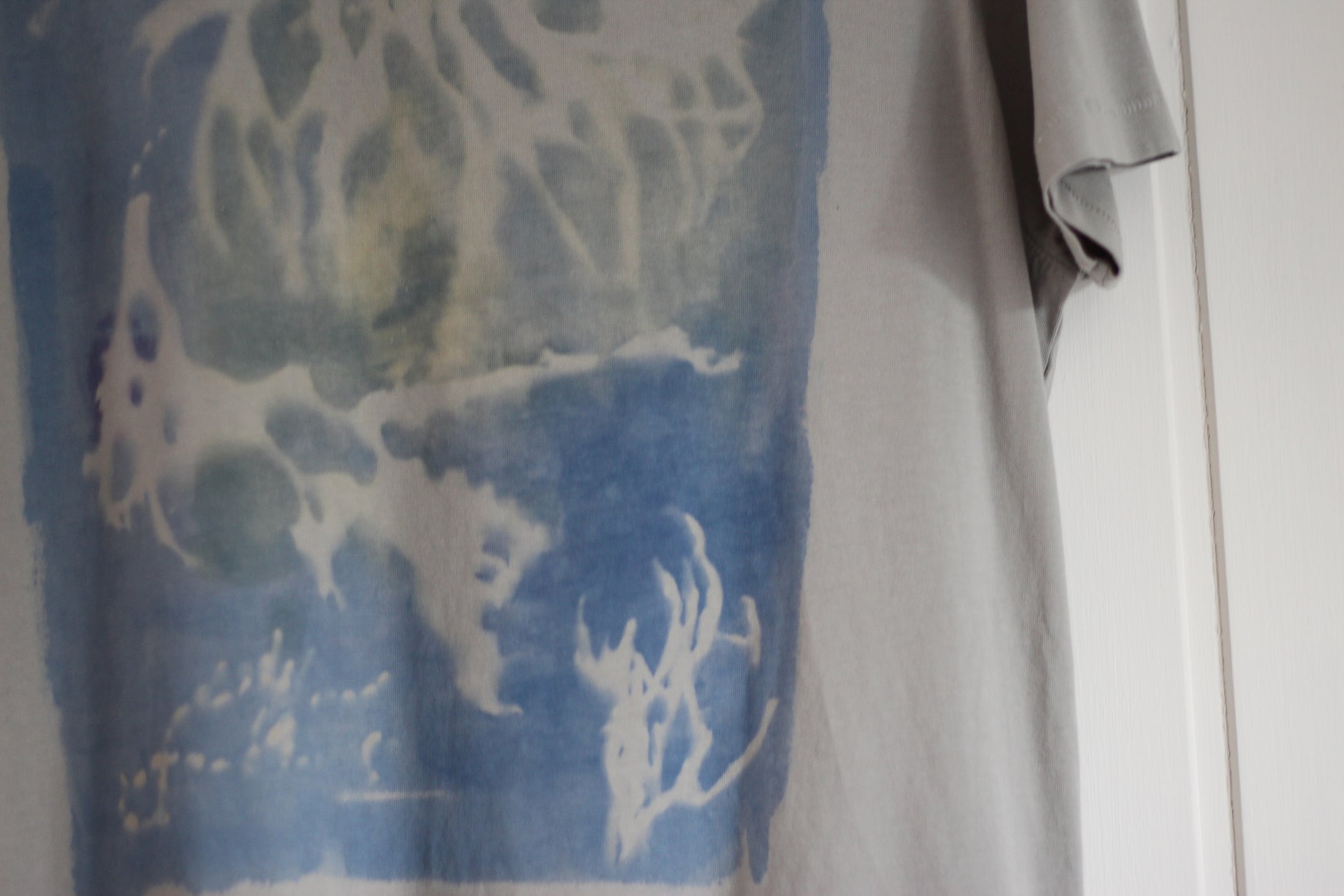 Graphic t-shirt with ocean-inspired sea sponge design, hand painted.
