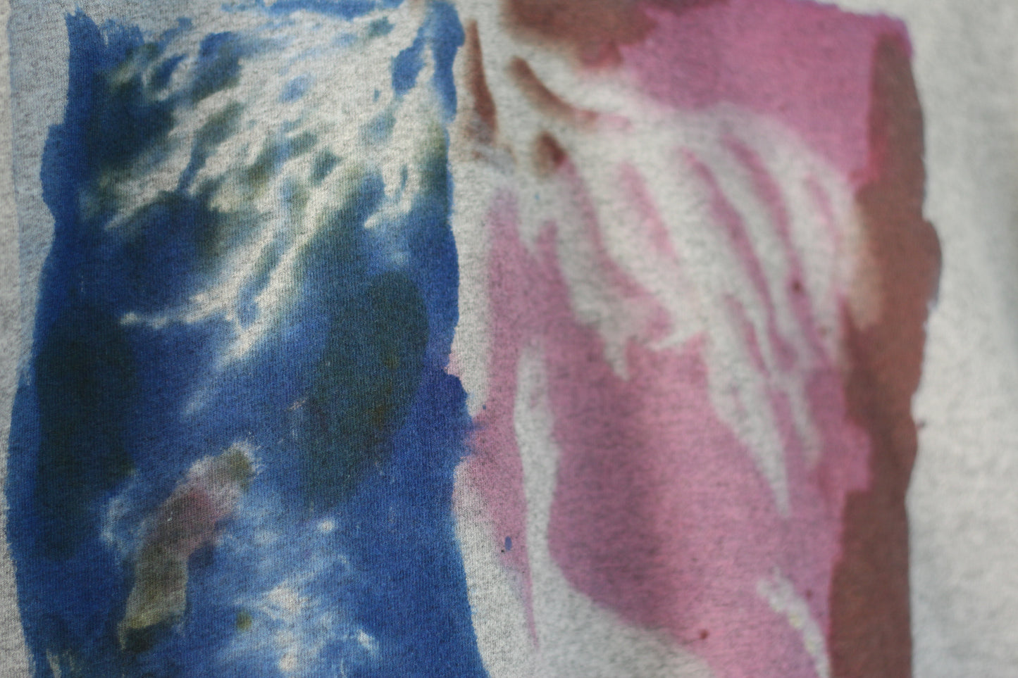 Blue and pink hand printed seaweed pattern on a grey t-shirt.