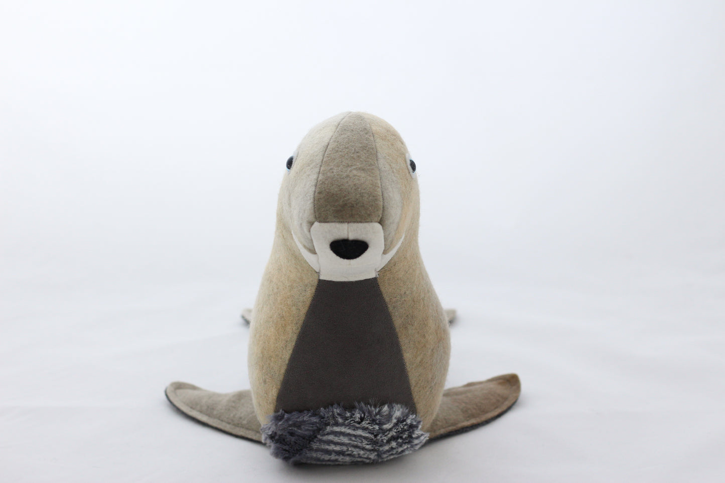 Stuffed animal seal toy on a white background