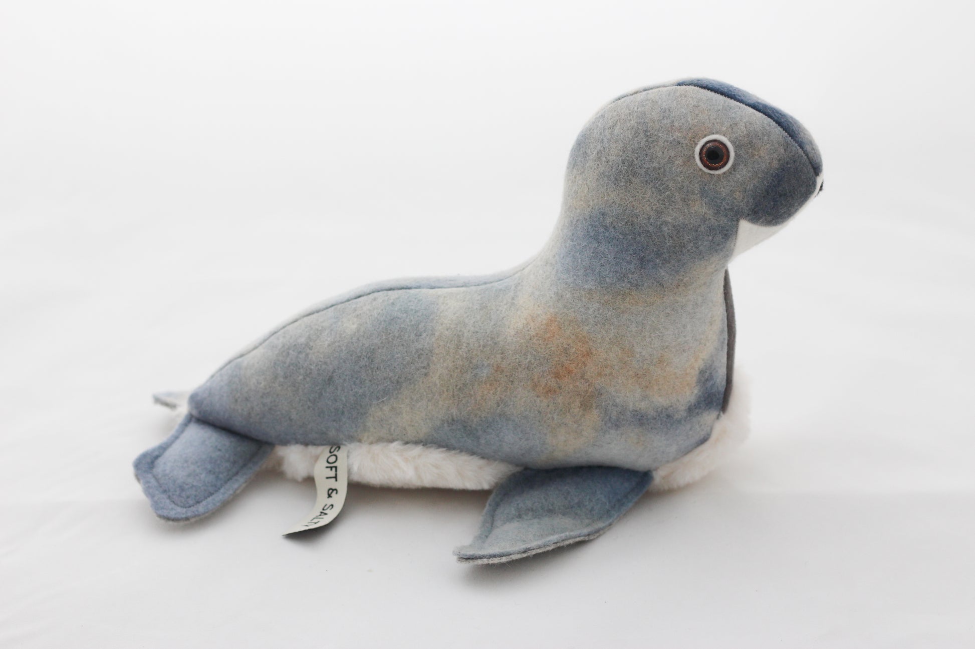 Plush toy seal on a white background