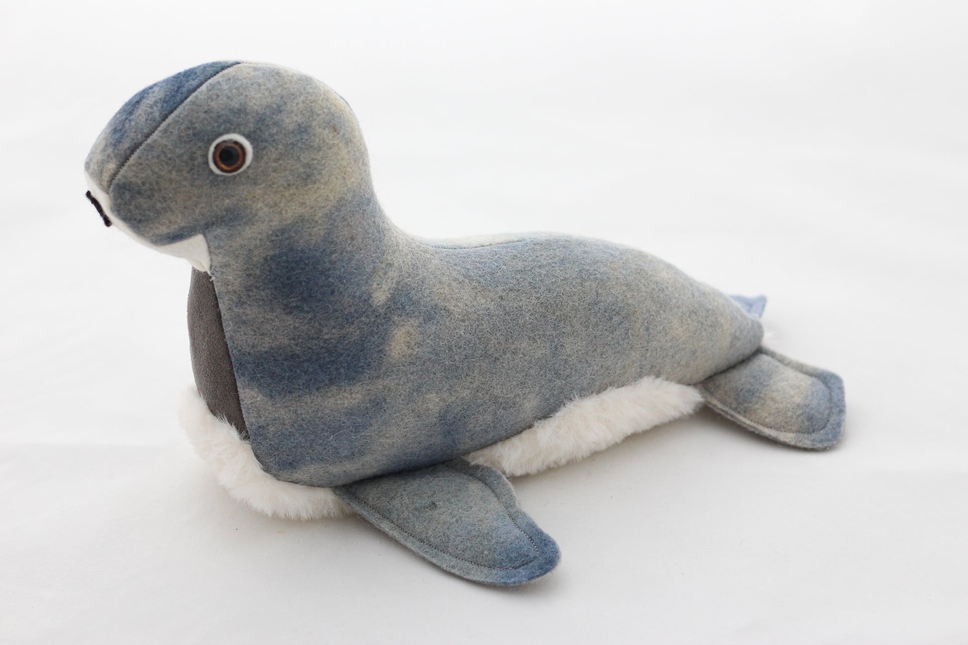 Plush toy seal on a white background