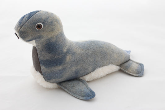 Plush toy seal on a white background