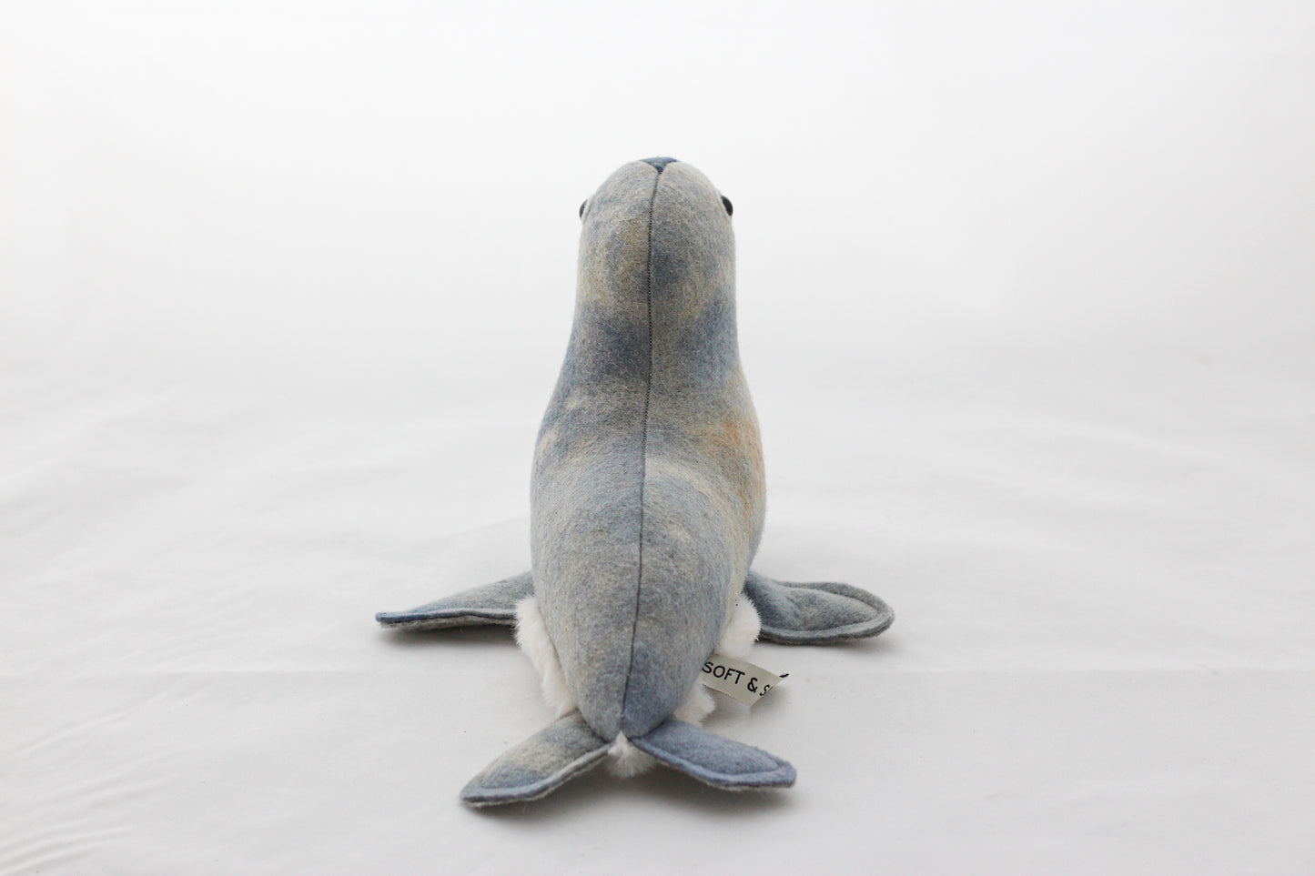 Plush toy seal on a white background
