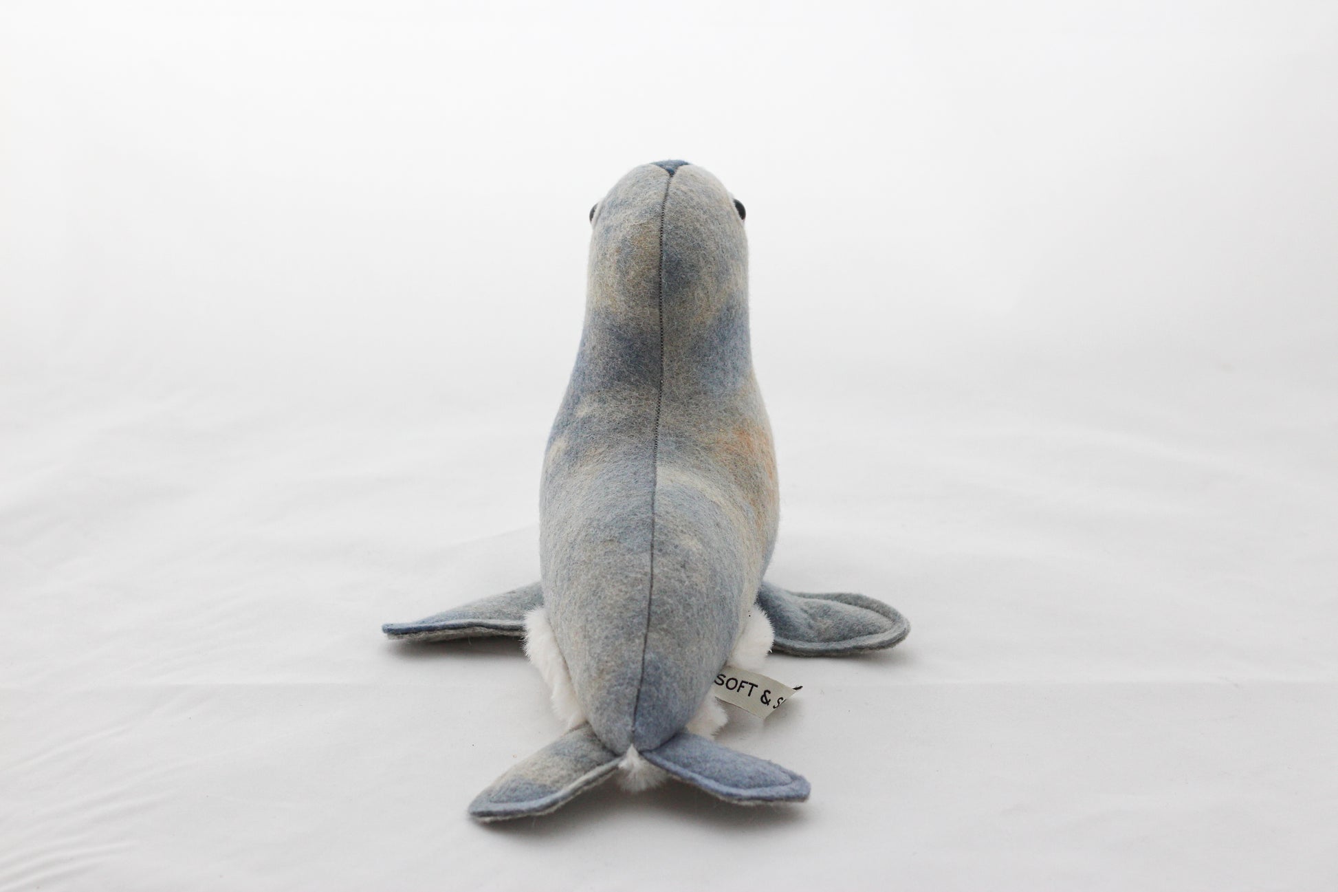 Plush toy seal on a white background