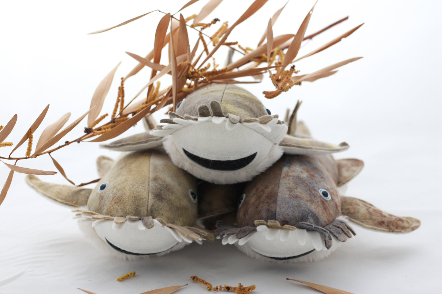 Three plush woggegong toys