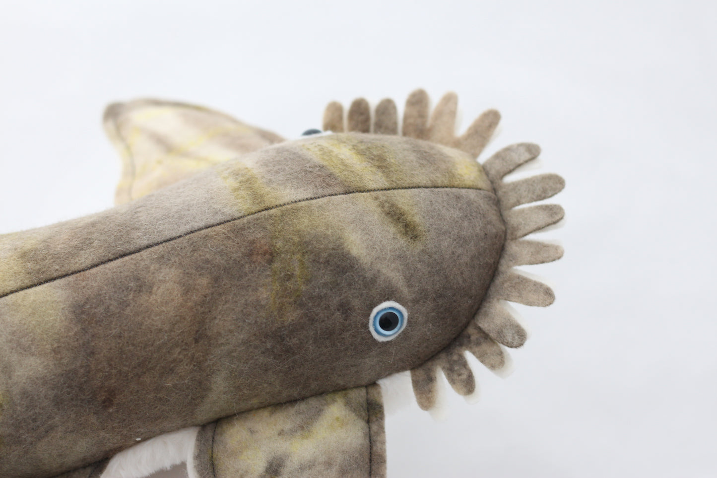 Plush wobbegong shark toy with brown and beige pattern on a white background