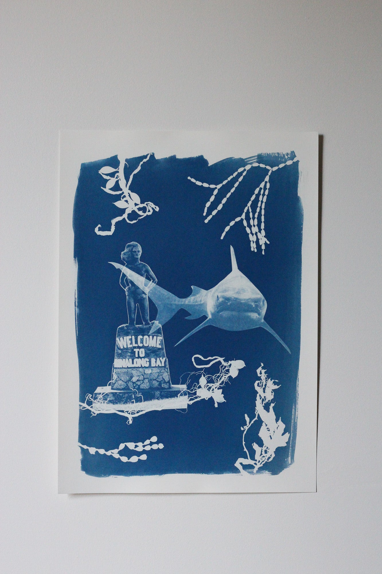 A Cyanotype print featuring Syrena of Binalong Bay and a Great White Shark surrounded by seaweed shapes.