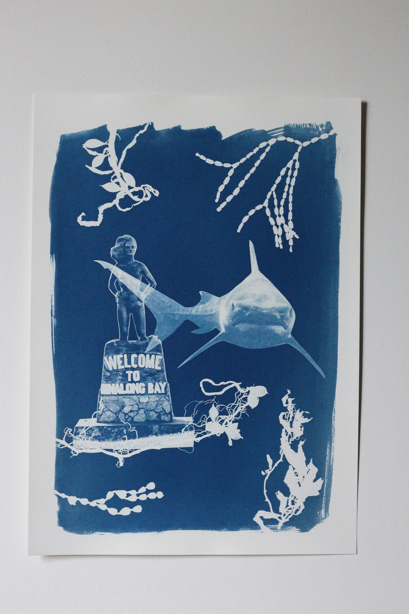 A Cyanotype print featuring Syrena of Binalong Bay and a Great White Shark surrounded by seaweed shapes.